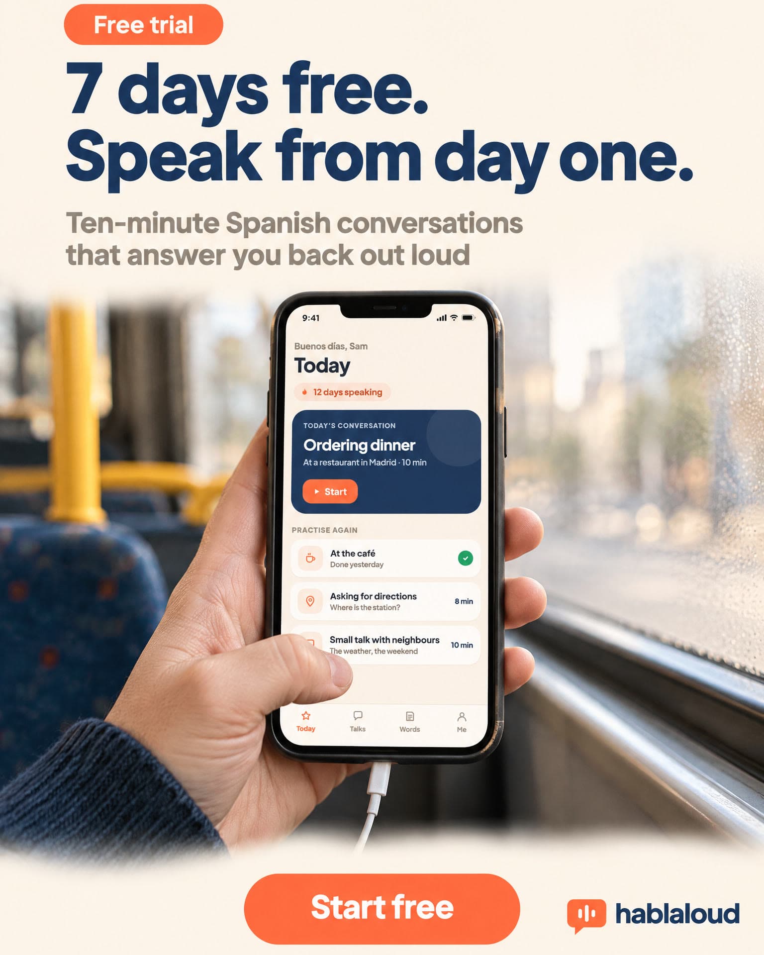A hand holds a phone showing the Hablaloud Today screen on a bus by a rainy window. It reads: Free trial. 7 days free. Speak from day one. Ten-minute Spanish conversations that answer you back out loud. Start free.